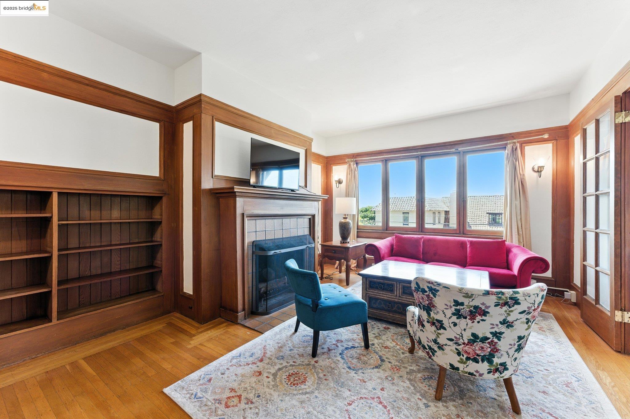 7 Panoramic Way Berkeley, CA 94704 - Photo 9 of 47 a living room with furniture windows and a fireplace