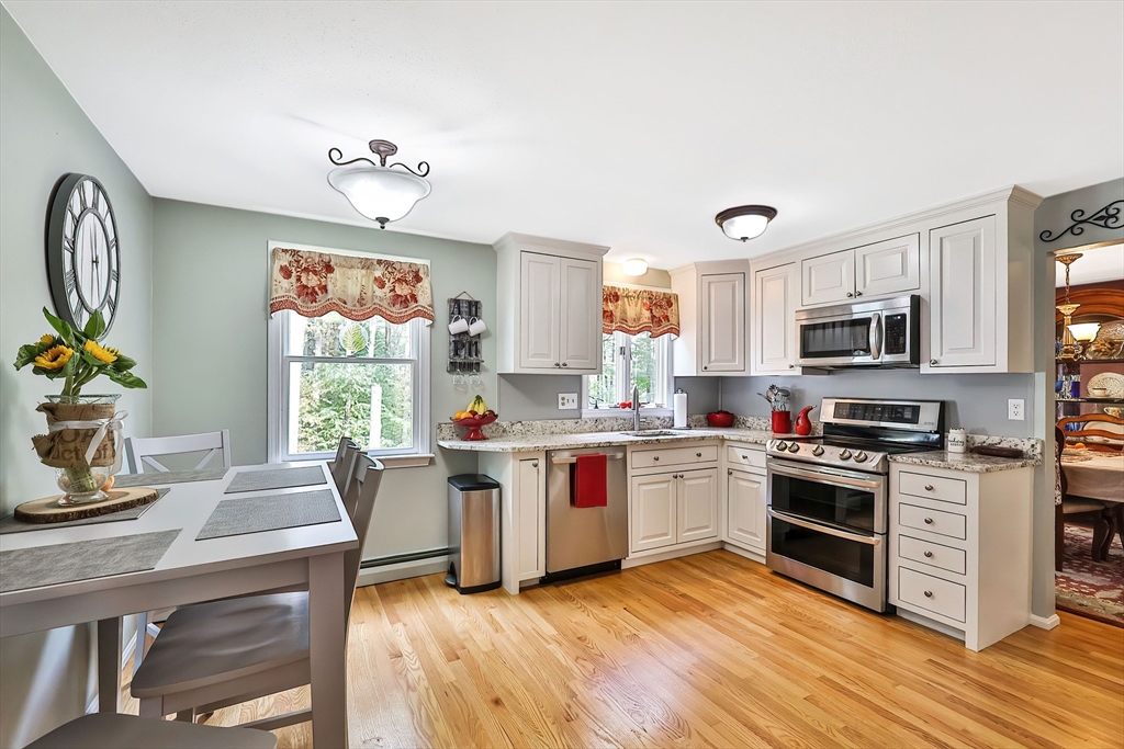 11 Puddingstone Lane Medway, MA 02053 - Photo 11 of 40 a kitchen with a stove top oven sink and cabinets