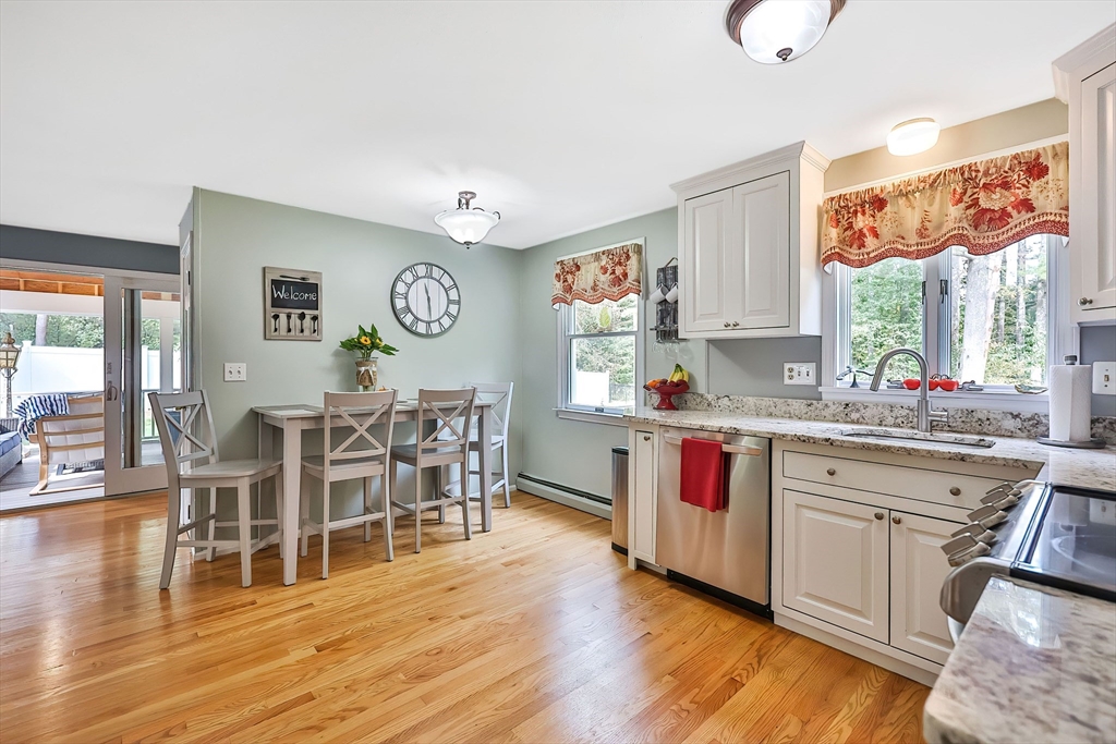 11 Puddingstone Lane Medway, MA 02053 - Photo 13 of 40 a open kitchen with stainless steel appliances granite countertop a stove and wooden floor
