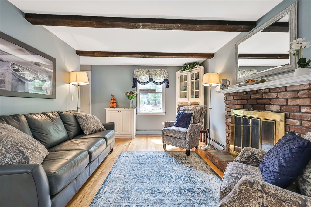 11 Puddingstone Lane Medway, MA 02053 - Photo 15 of 40 a living room with furniture and a fireplace