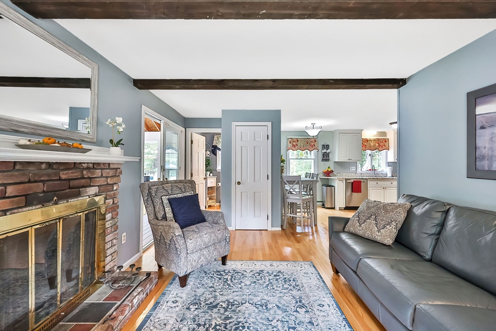 11 Puddingstone Lane Medway, MA 02053 - Photo 16 of 40 a living room with furniture and a fireplace
