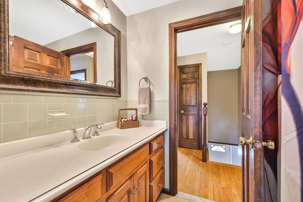 11 Puddingstone Lane Medway, MA 02053 - Photo 18 of 40 a bathroom with a sink and a mirror