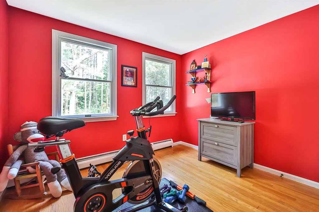 11 Puddingstone Lane Medway, MA 02053 - Photo 26 of 40 a room with furniture and a flat screen tv