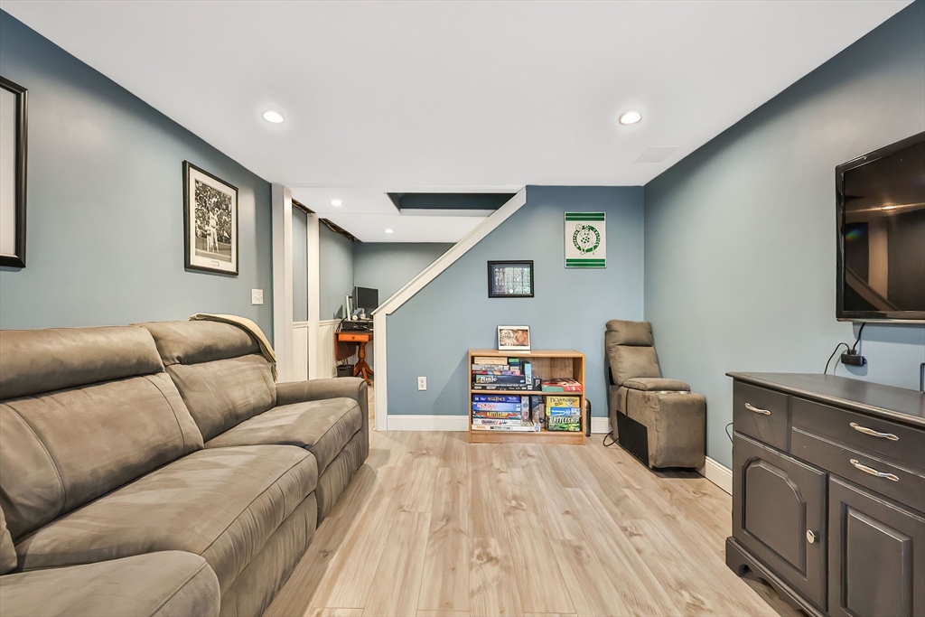 11 Puddingstone Lane Medway, MA 02053 - Photo 31 of 40 a living room with furniture and a flat screen tv