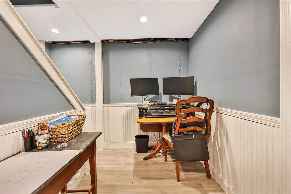 11 Puddingstone Lane Medway, MA 02053 - Photo 32 of 40 a view of a workspace with furniture and a flat screen tv