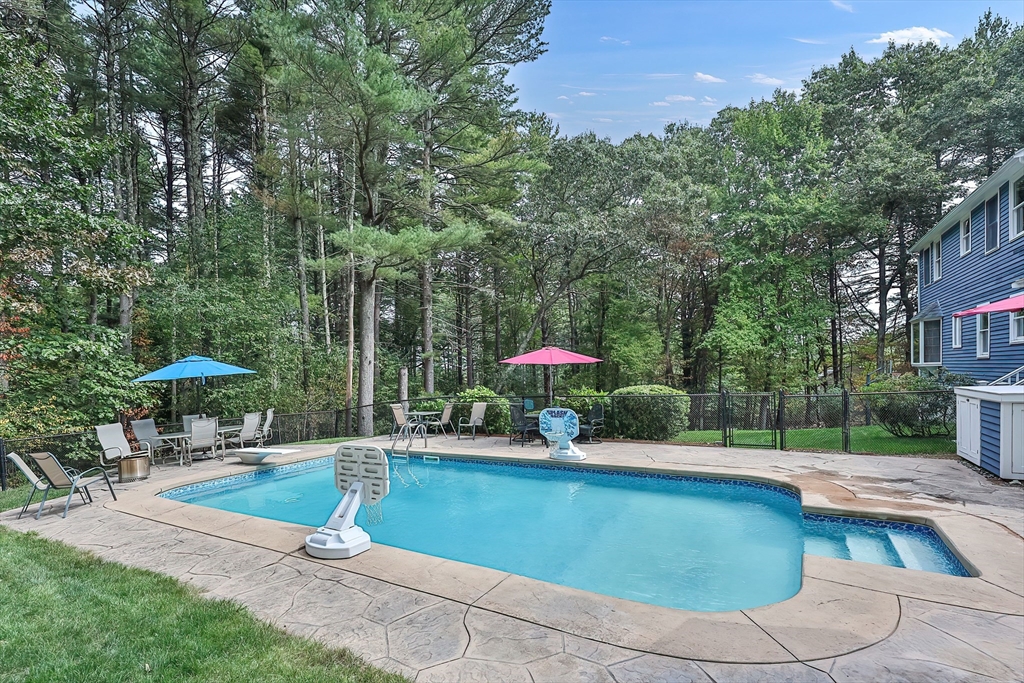 11 Puddingstone Lane Medway, MA 02053 - Photo 37 of 40 a view of a swimming pool with sitting area