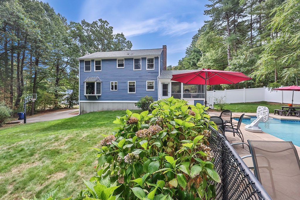 11 Puddingstone Lane Medway, MA 02053 - Photo 39 of 40 an outdoor space with furniture and umbrella