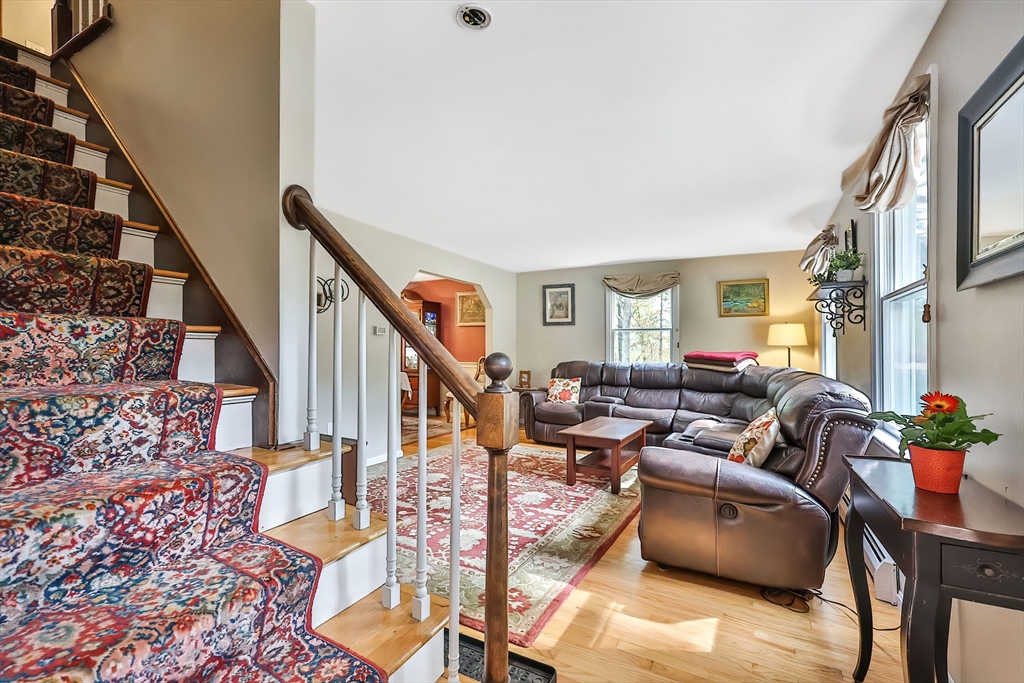 11 Puddingstone Lane Medway, MA 02053 - Photo 5 of 40 a living room with furniture or stairs and a wooden floor