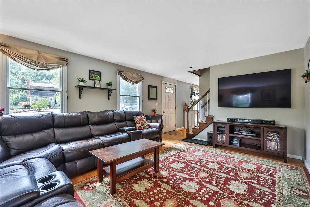 11 Puddingstone Lane Medway, MA 02053 - Photo 7 of 40 a living room with furniture and a flat screen tv