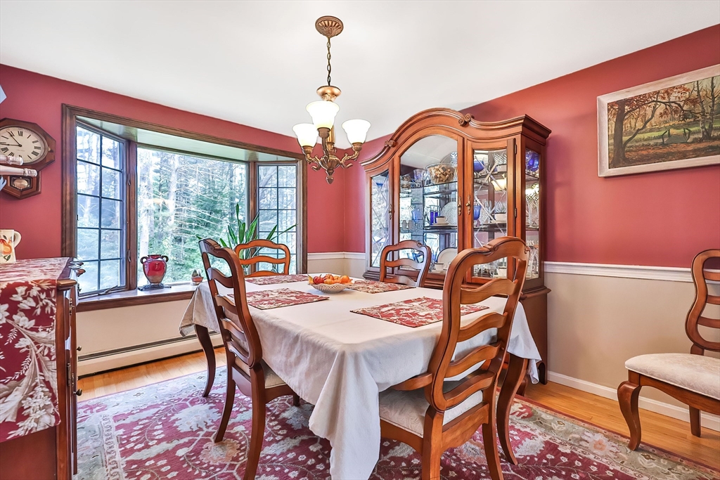 11 Puddingstone Lane Medway, MA 02053 - Photo 8 of 40 a view of a dining room with furniture a chandelier and wooden floor