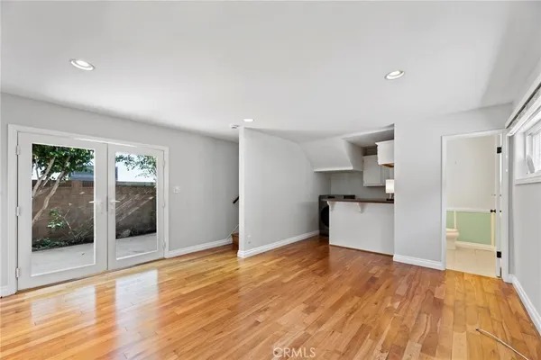 a view of kitchen with furniture and wooden floor