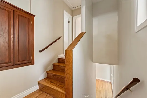 a view of entryway with wooden floor and stairs