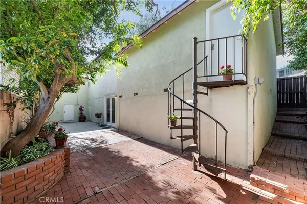 a view of a house with wooden stairs