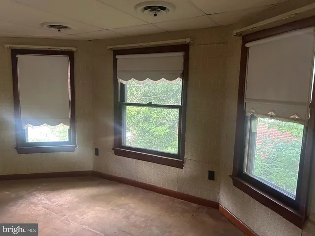 an empty room with wooden floor