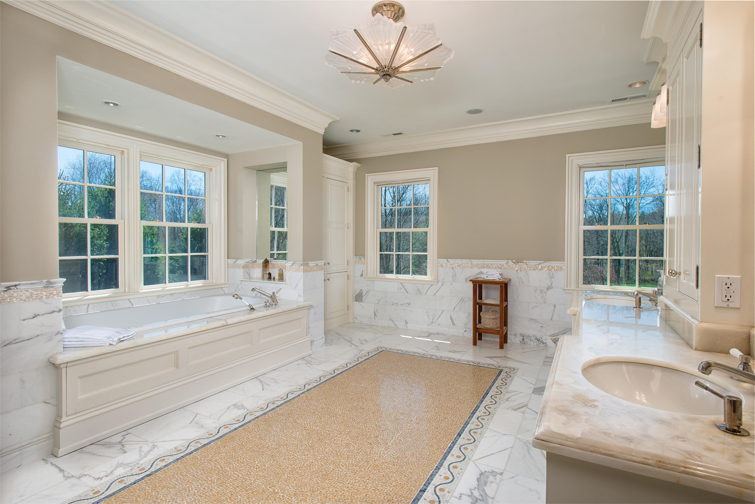 1480 Ponus Ridge Road New Canaan, CT 06840 - Photo 11 of 22 a spacious bathroom with a granite countertop tub sink and large window
