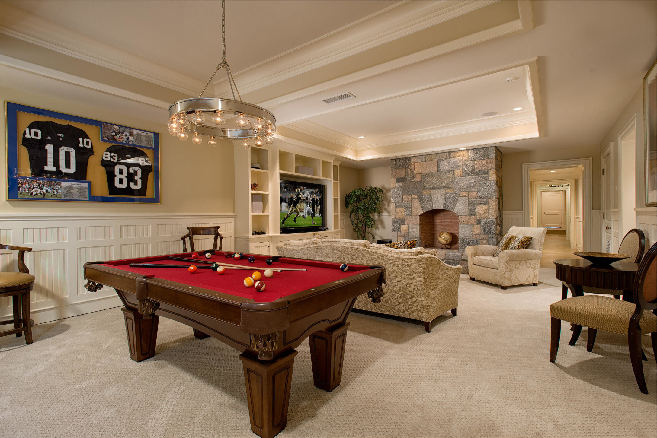 1480 Ponus Ridge Road New Canaan, CT 06840 - Photo 16 of 22 a living room with furniture and a chandelier
