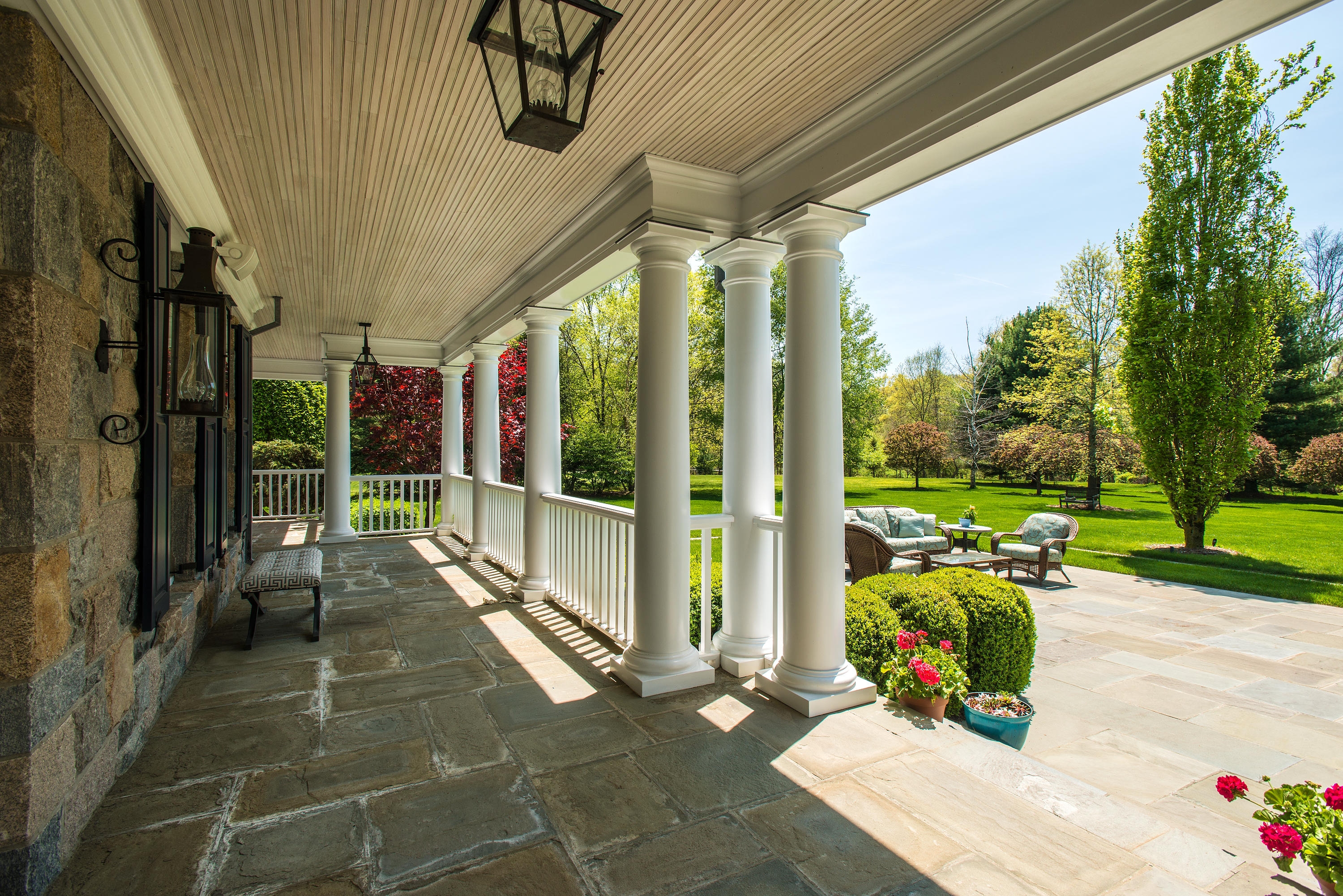 1480 Ponus Ridge Road New Canaan, CT 06840 - Photo 18 of 22 a view of a porch with furniture