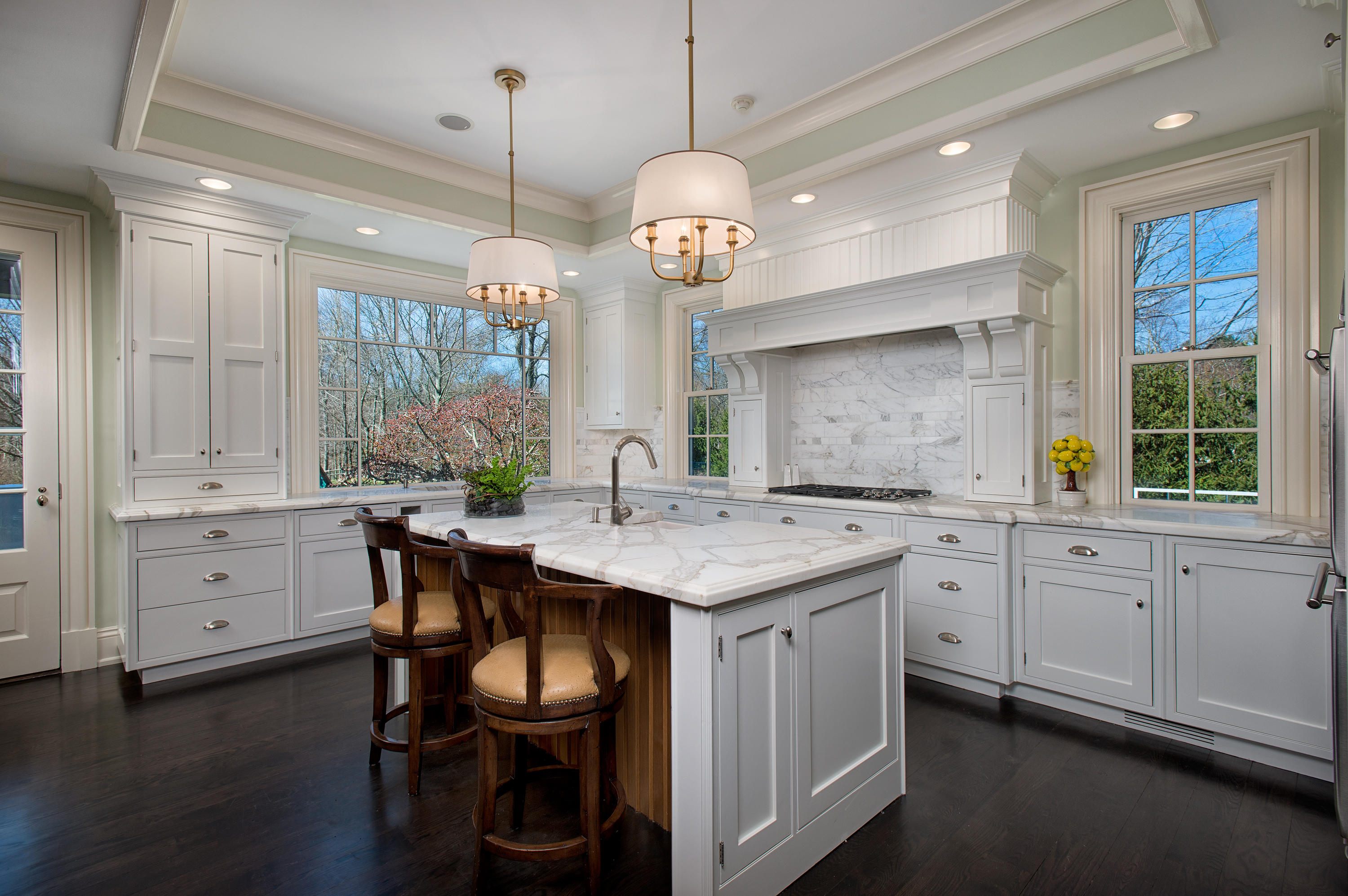 1480 Ponus Ridge Road New Canaan, CT 06840 - Photo 7 of 22 a kitchen with cabinets table and chairs
