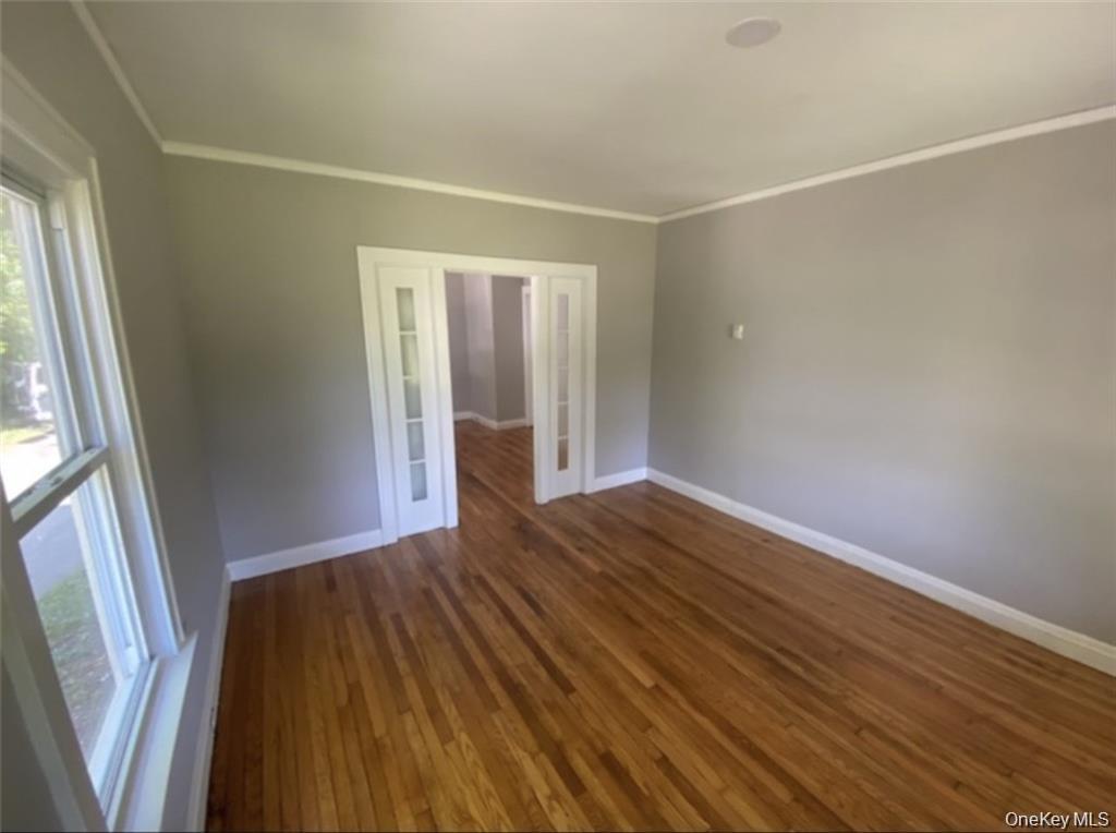 762 Old Rte 22 Amenia, NY 12501 - Photo 12 of 25 an empty room with wooden floor and windows