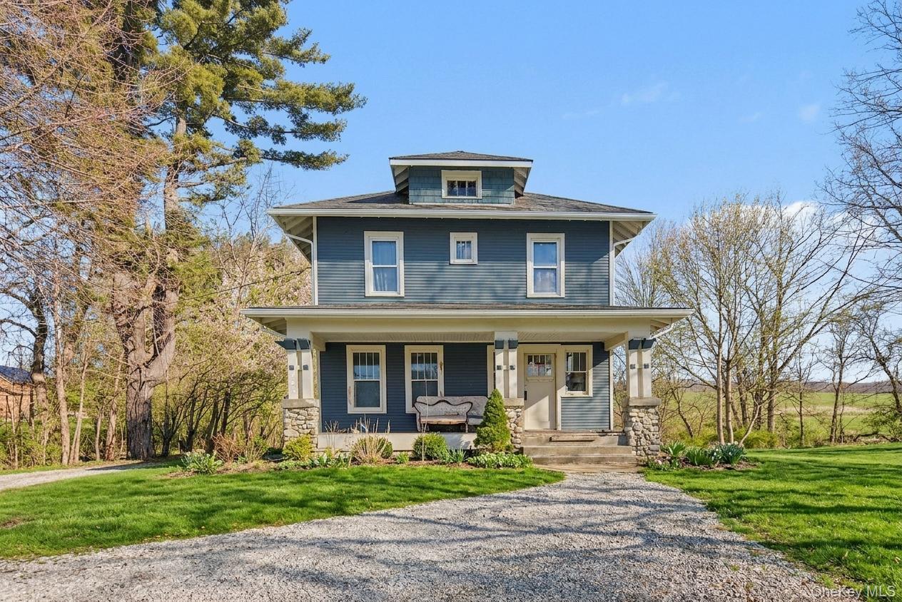 762 Old Rte 22 Amenia, NY 12501 - Photo 2 of 25 a front view of a house with a garden
