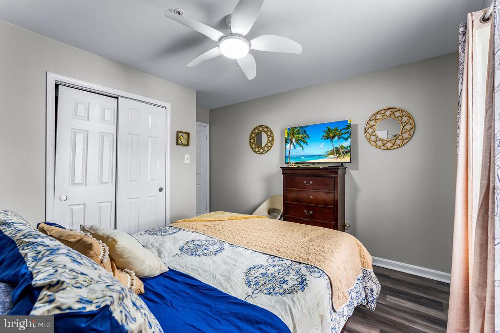 11409 Hermosa Drive Laurel, MD 20708 - Photo 23 of 28 a bedroom with a bed and a chandelier