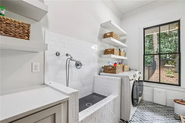 a bathroom with a toilet a sink and a mirror