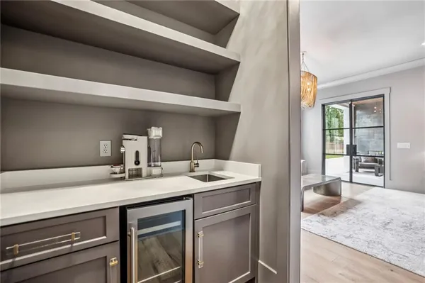 a spacious bathroom with a granite countertop sink and mirror