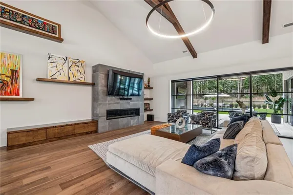 a living room with furniture and a flat screen tv