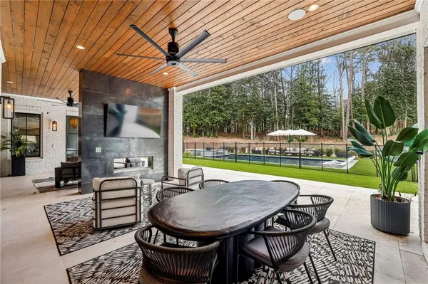 a view of a backyard with swimming pool