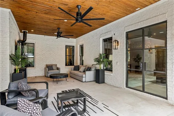 a view of a house with a yard porch and sitting area