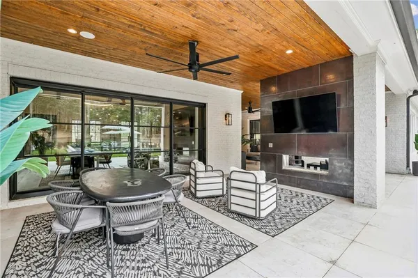 a view of a swimming pool with a patio