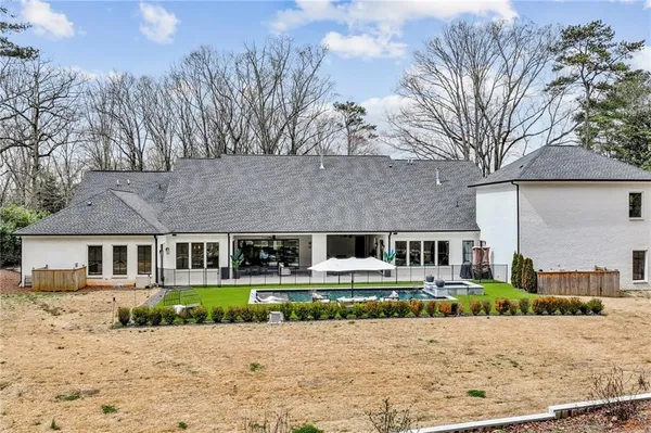an aerial view of a house with outdoor space