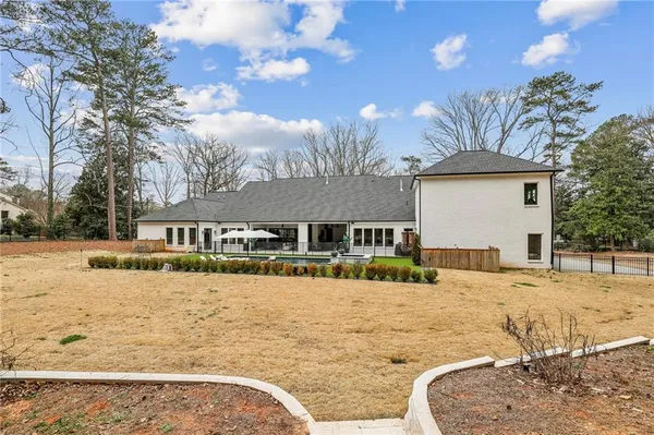 an aerial view of a house with outdoor space