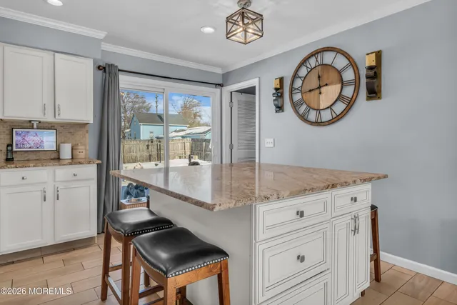 a view of a kitchen with stove and cabinets
