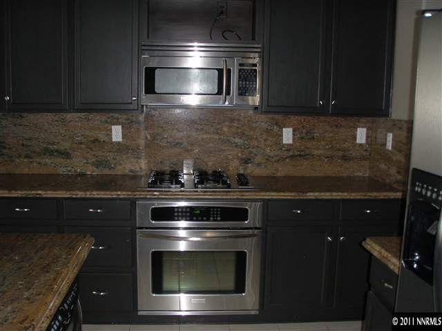 1794 Kodiak Circle Reno, NV 89511 - Photo 4 of 13 a kitchen with a stove and a microwave