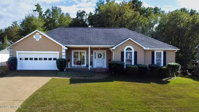 a house view with a garden space