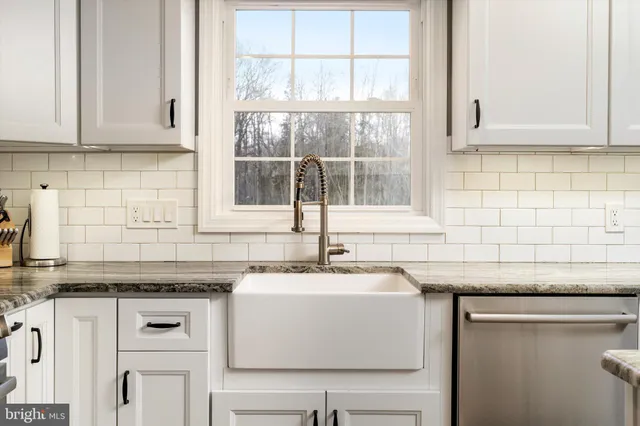 a bedroom with bed and a window