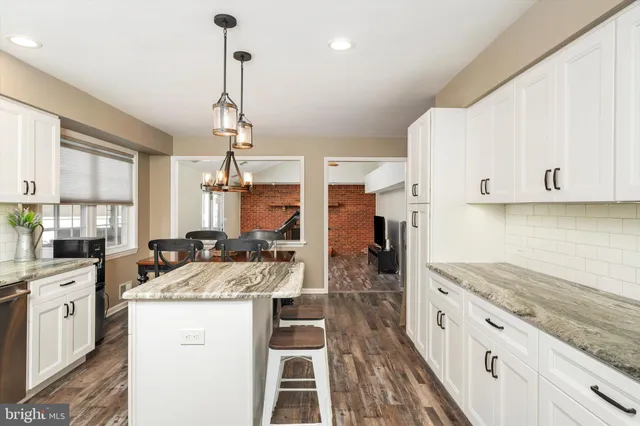 a living room with a bed furniture and a window