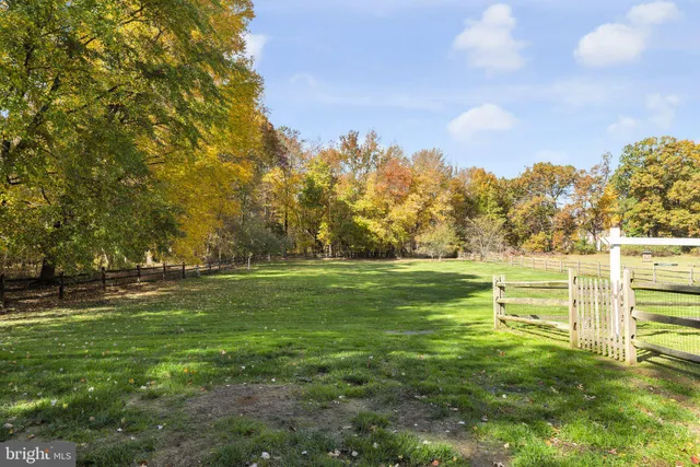 a view of a big yard with a house