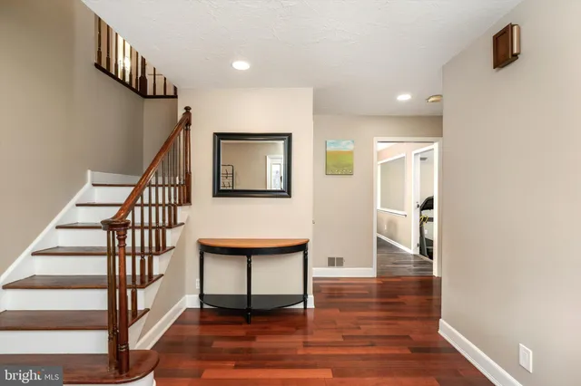a view of entryway with wooden floor