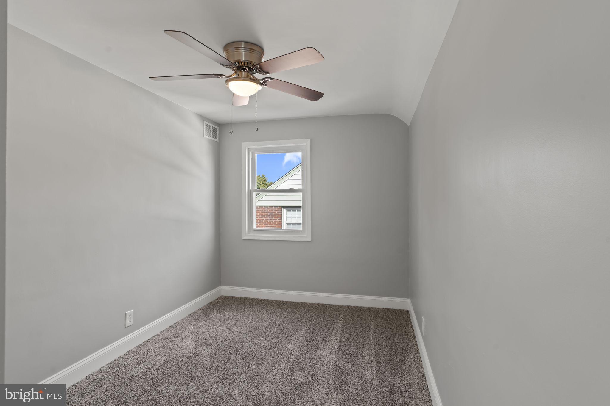 416 Adair Road Holmes, PA 19043 - Photo 18 of 32 an empty room with a window and a fan