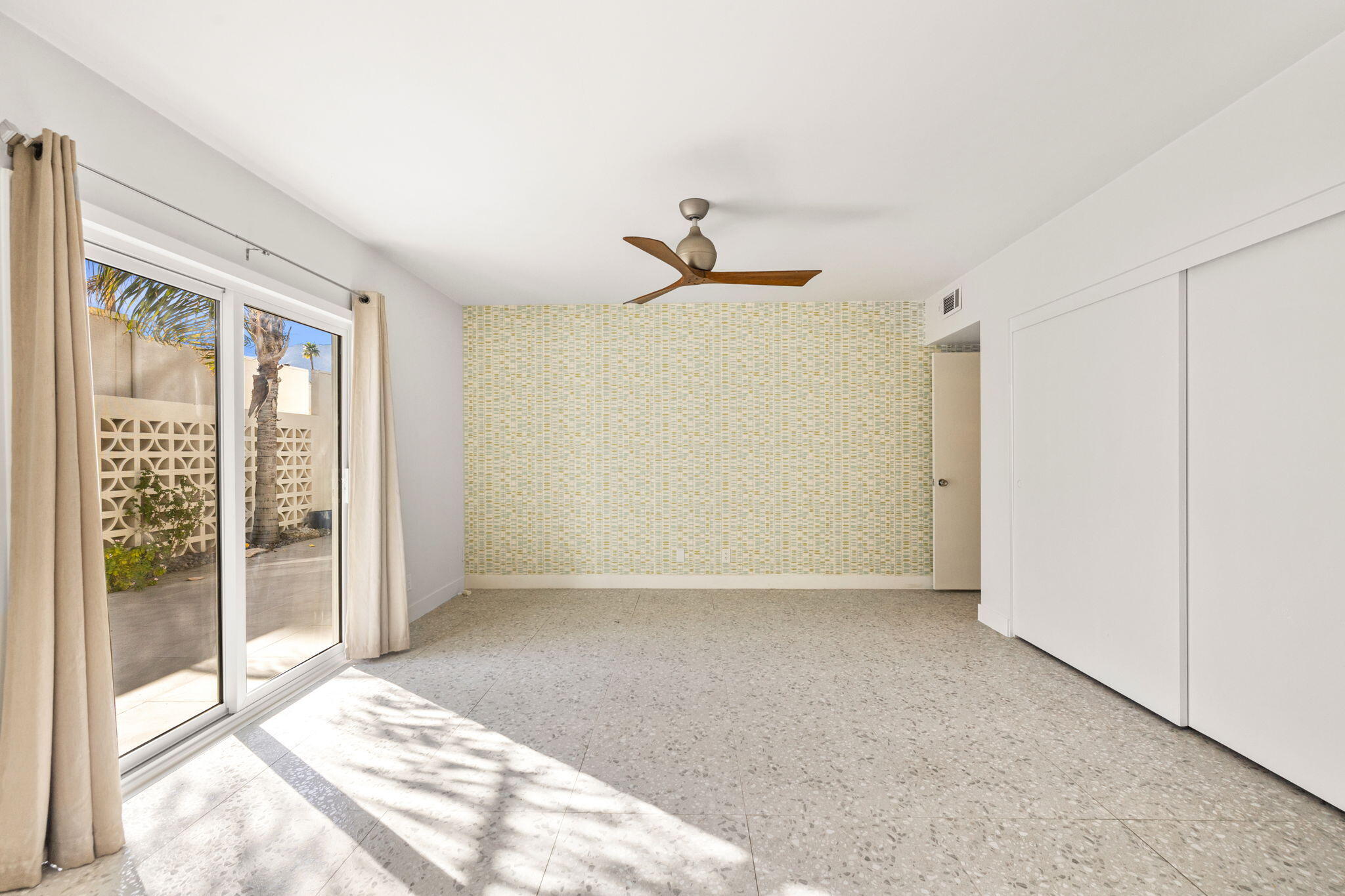 1810 Sandcliff Road Palm Springs, CA 92264 - Photo 17 of 55 a view of an empty room with glass door