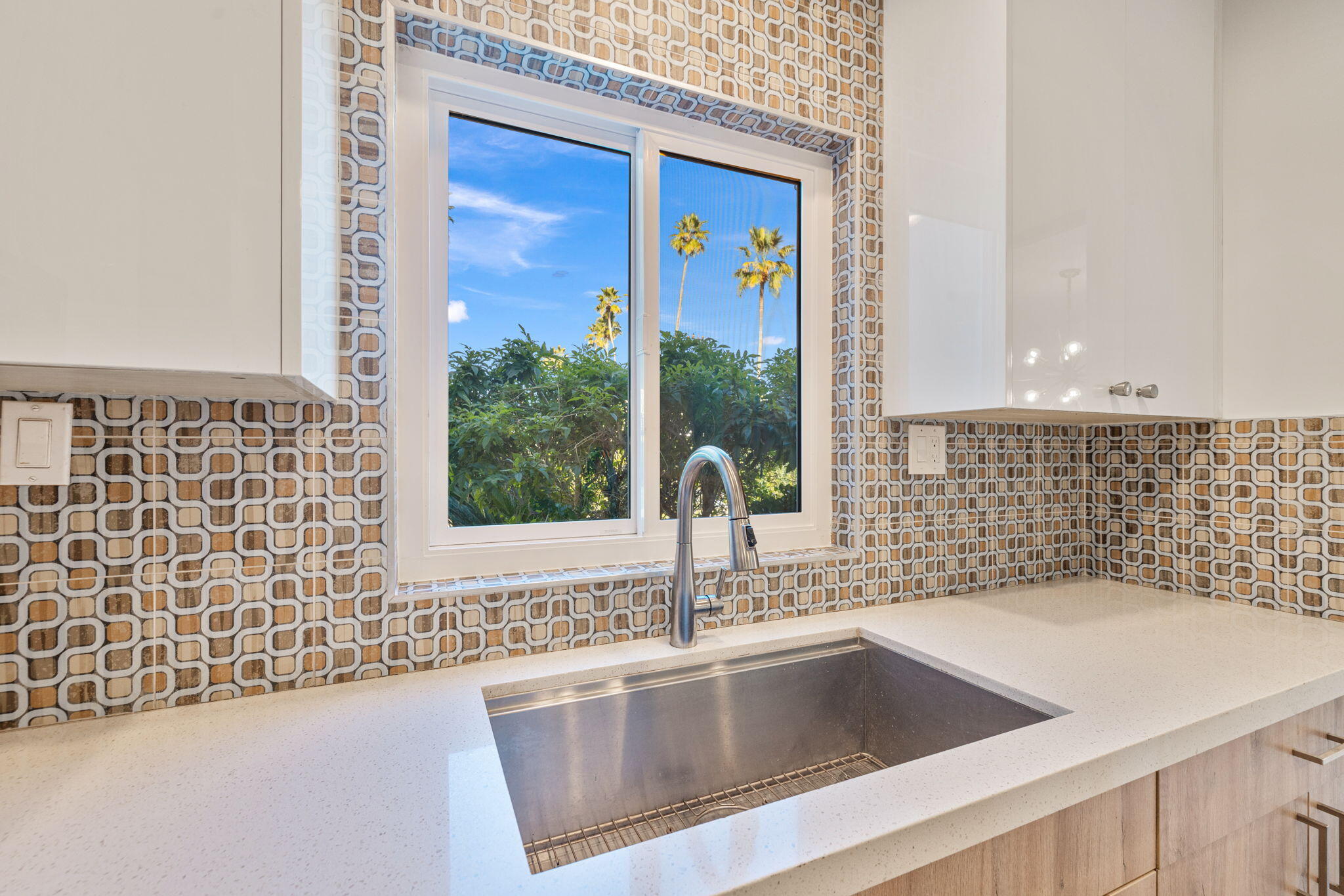 1810 Sandcliff Road Palm Springs, CA 92264 - Photo 21 of 55 a view of a kitchen that has a sink and a window