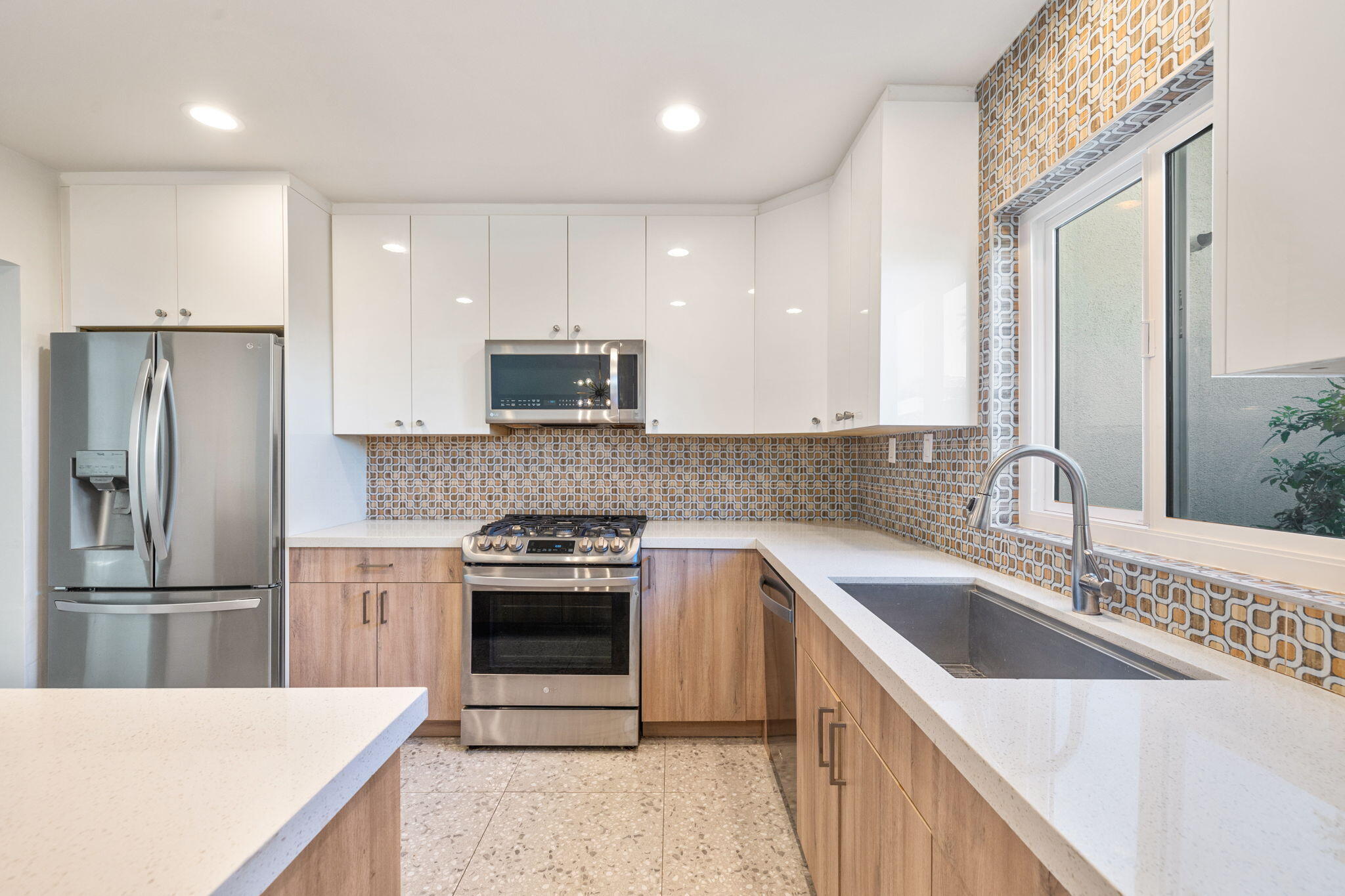 1810 Sandcliff Road Palm Springs, CA 92264 - Photo 22 of 55 a kitchen with a sink stove and refrigerator