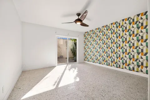 a spacious bathroom with a shower curtain and a sink