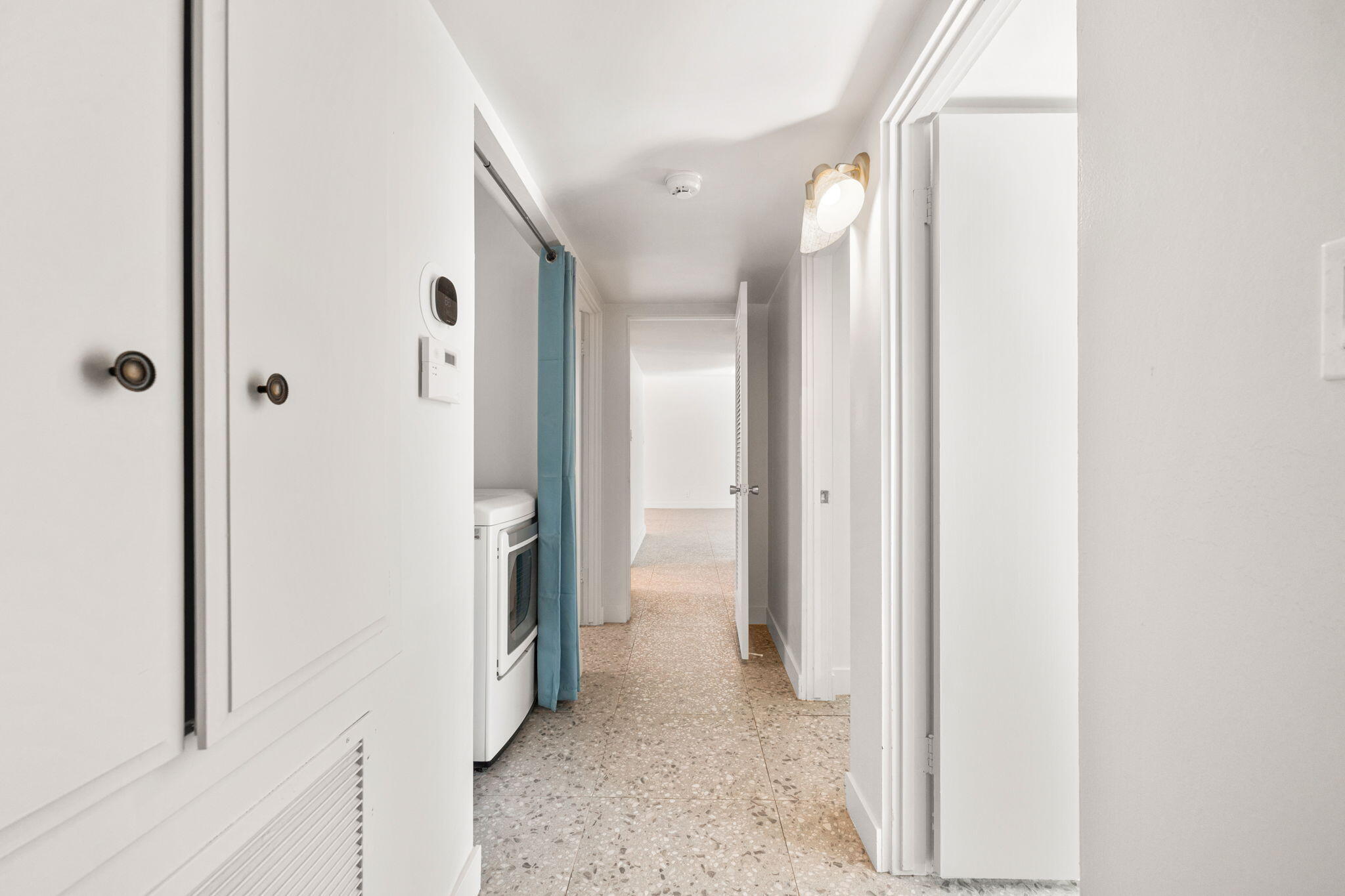 1810 Sandcliff Road Palm Springs, CA 92264 - Photo 37 of 55 a view of a hallway with white walls