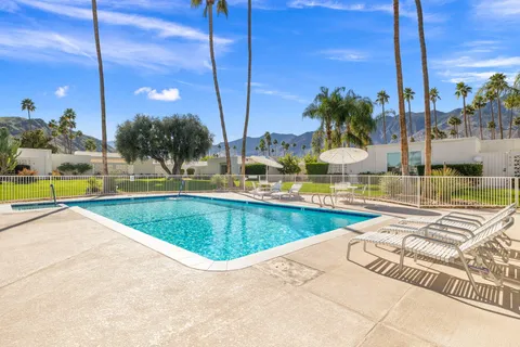 a view of a swimming pool with a patio