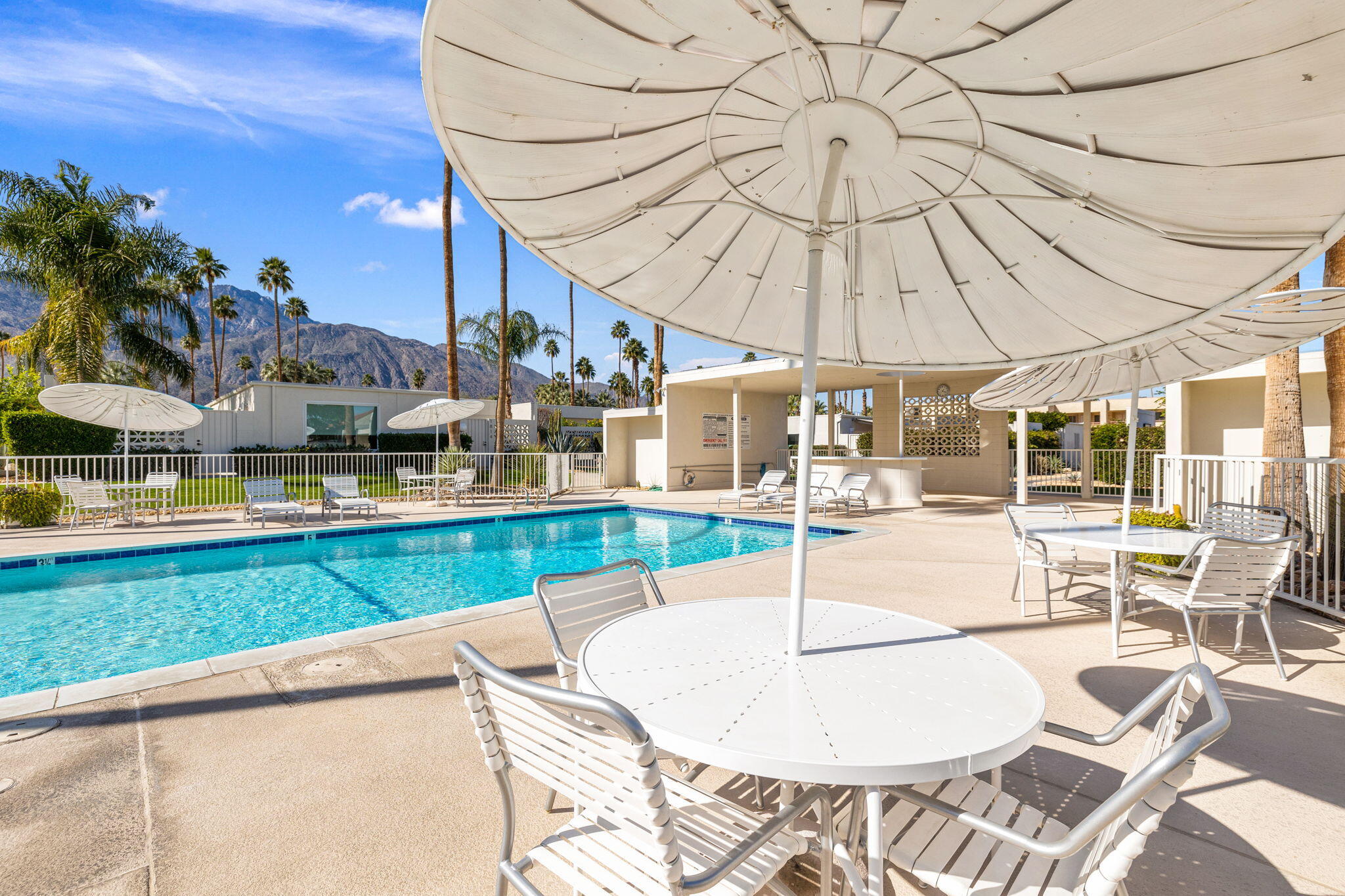 1810 Sandcliff Road Palm Springs, CA 92264 - Photo 49 of 55 a swimming pool with outdoor seating and yard