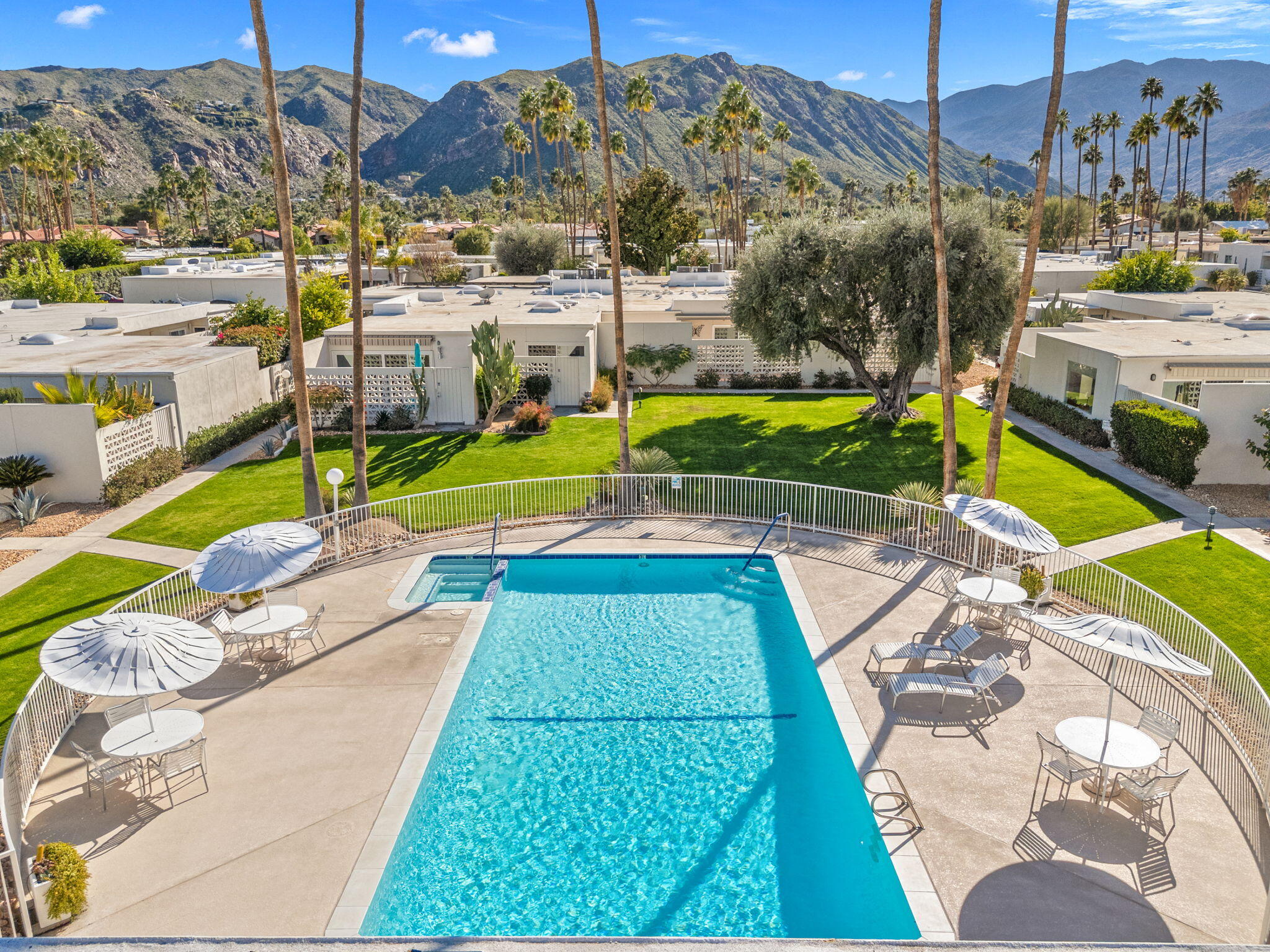 1810 Sandcliff Road Palm Springs, CA 92264 - Photo 52 of 55 a view of a swimming pool with a patio