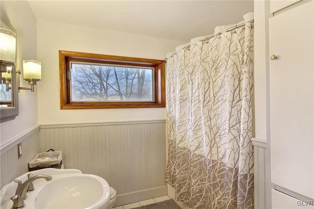 2000 Laural Street Stroudsburg, PA 18360 - Photo 10 of 14 a bathroom with a toilet and shower curtain